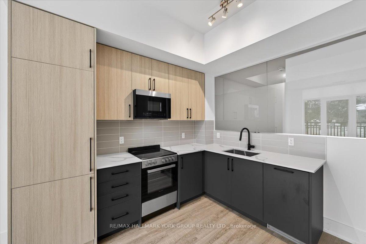 Photo 8 of Unit 112, 2075 King Road, King, King City — HOMEH