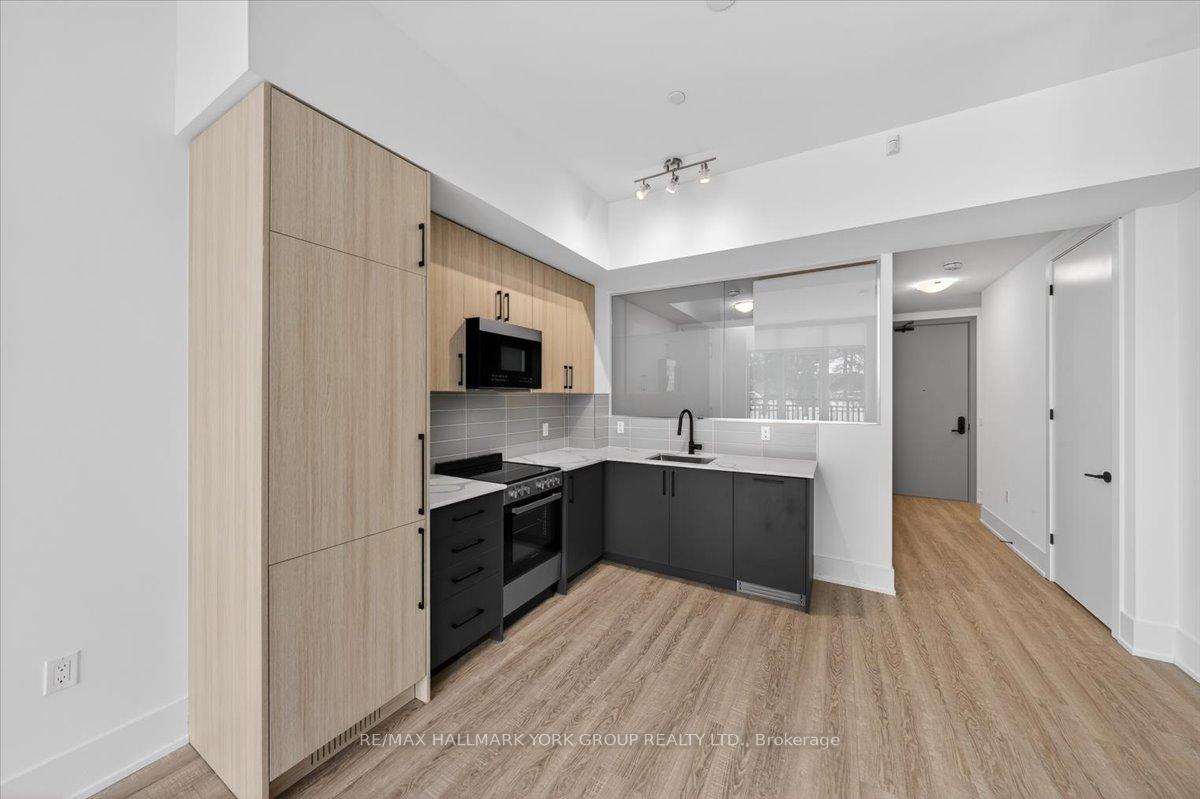 Photo 9 of Unit 112, 2075 King Road, King, King City — HOMEH