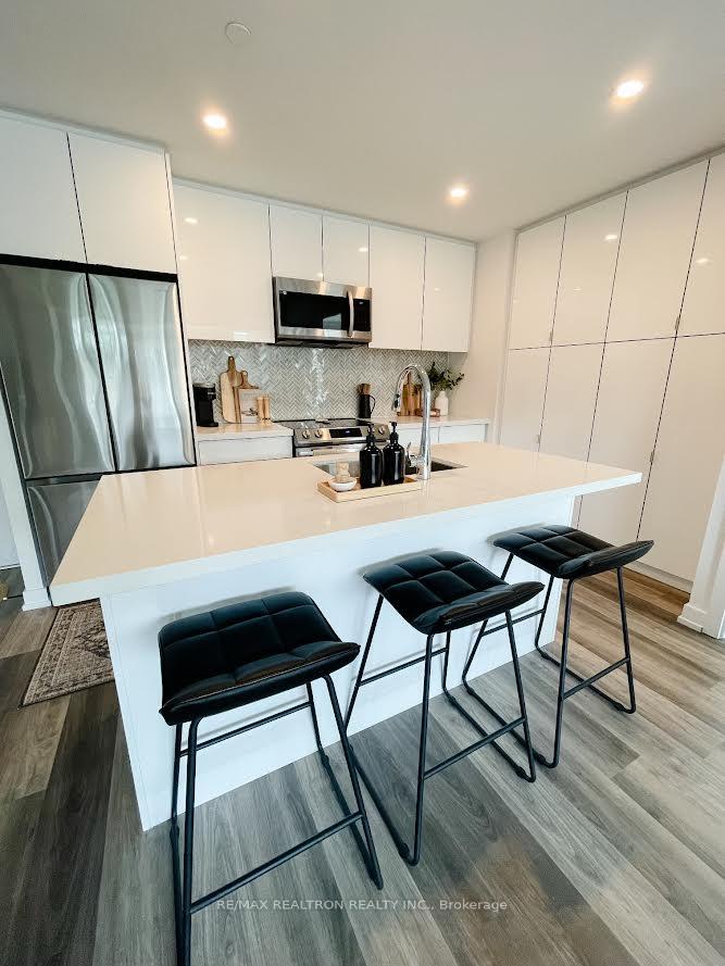 Photo 6 of Unit 320, 415 Sea Ray Avenue, Innisfil, Rural Innisfil — HOMEH