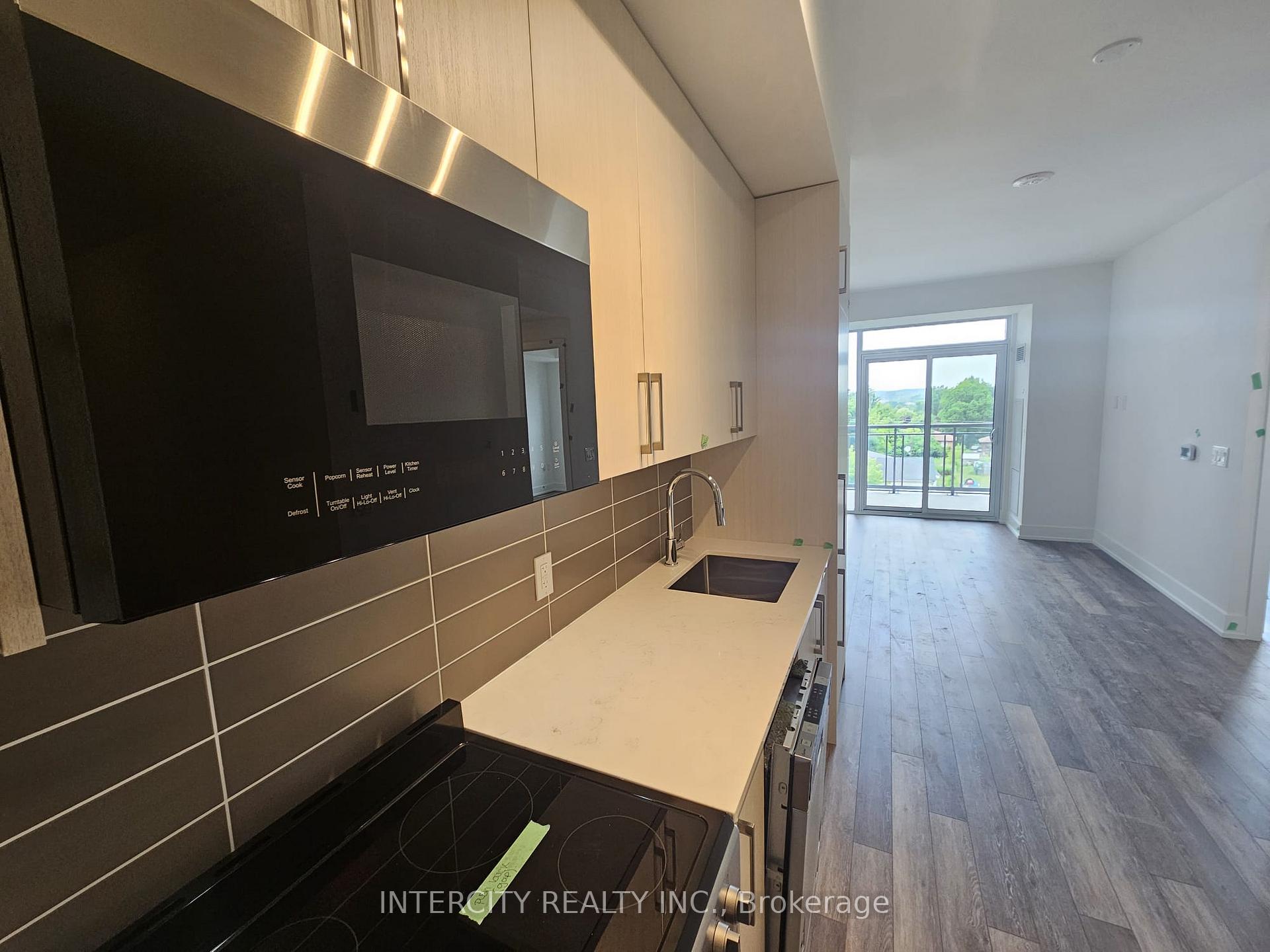 Photo 3 of Unit 433, 2075 King Road, King, King City — HOMEH