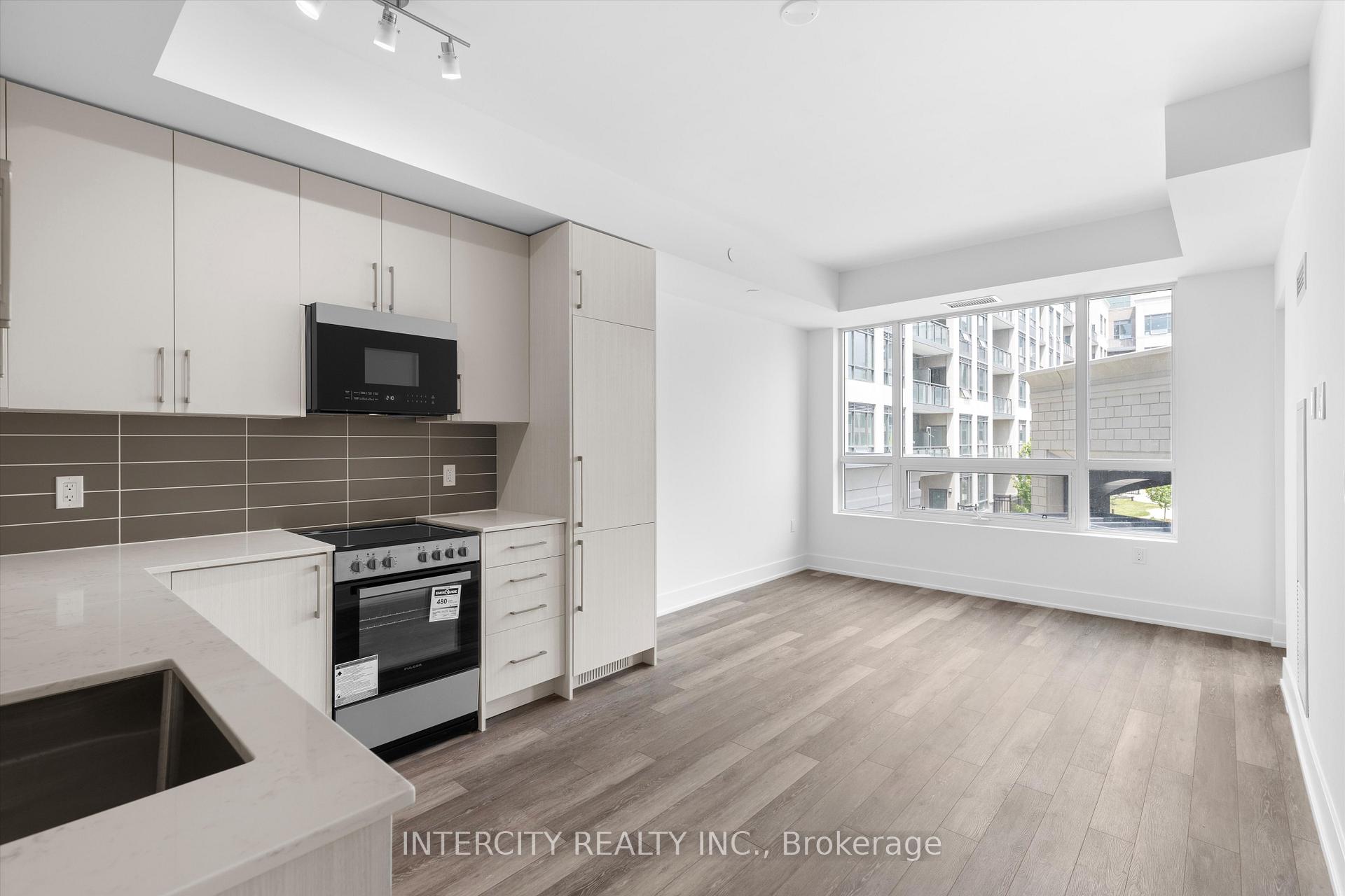 Photo 2 of Unit 213, 2075 King Road, King, King City — HOMEH