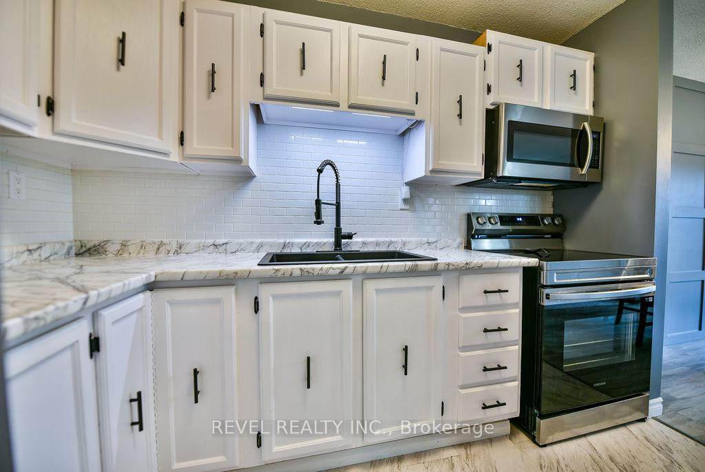 Photo 21 of 545 Lonergan Boulevard, Timmins, TNW - Riverpark — HOMEH