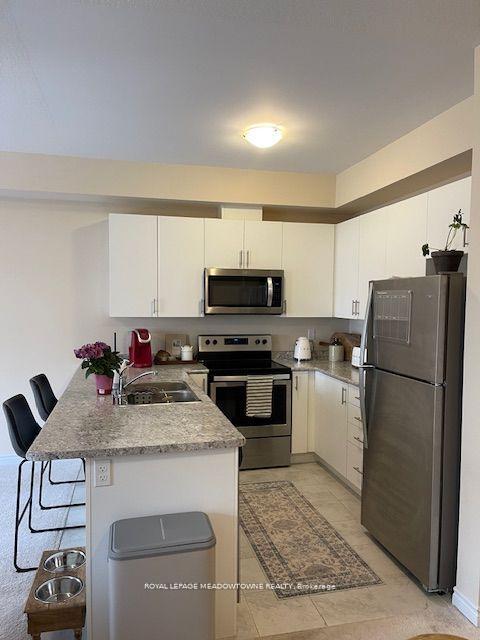 Photo 7 of Unit 28, 88 Decorso Drive, Guelph, Kortright East — HOMEH