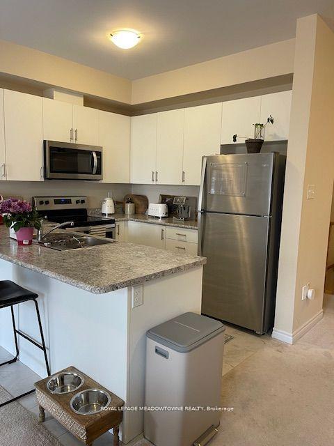 Photo 3 of Unit 28, 88 Decorso Drive, Guelph, Kortright East — HOMEH