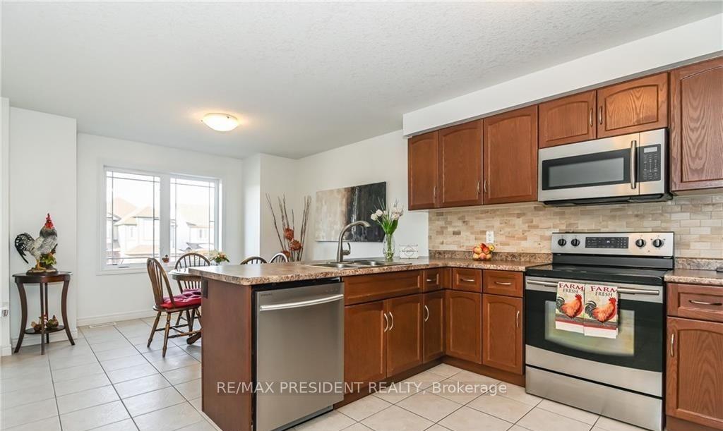 Photo 5 of 27 Oakes Crescent, Guelph, Grange Road — HOMEH