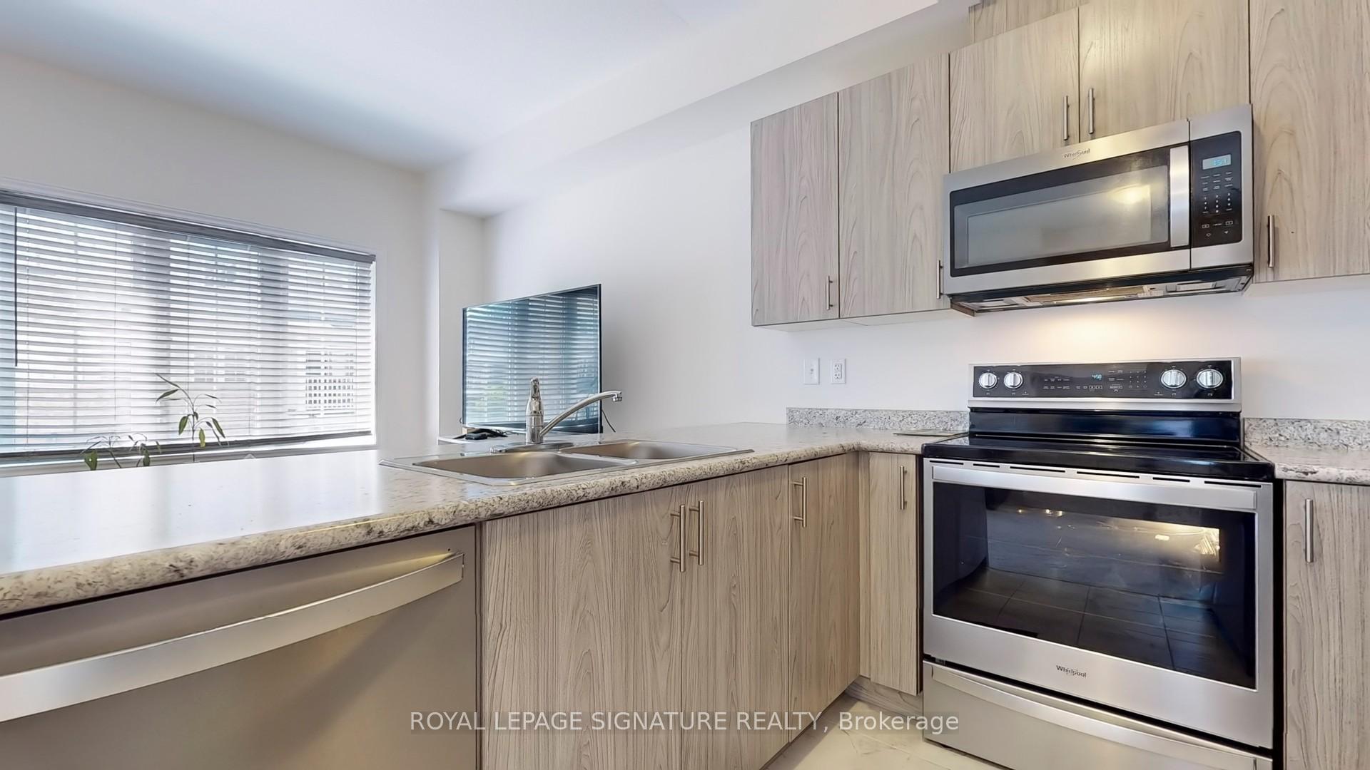 Photo 12 of Unit 13, 88 Decorso Drive, Guelph, Kortright East — HOMEH