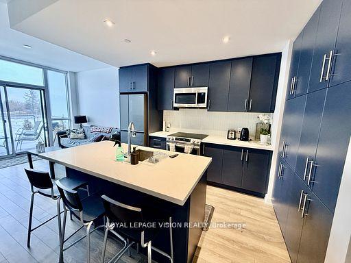Photo 5 of Unit 407, 375 Sea Ray Avenue, Innisfil, Rural Innisfil — HOMEH