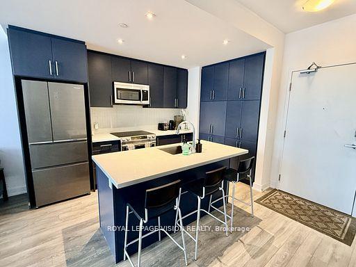 Photo 7 of Unit 407, 375 Sea Ray Avenue, Innisfil, Rural Innisfil — HOMEH