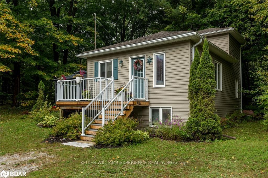 Front of 2486 Houseys Rapids Road