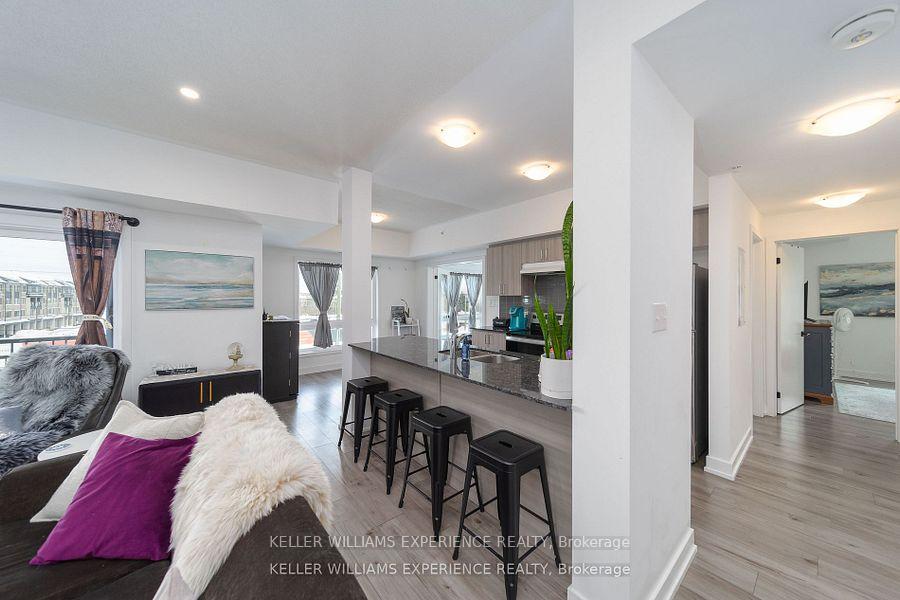 Photo 3 of Unit 102, 4 Spice Way, Barrie, Innis-Shore — HOMEH
