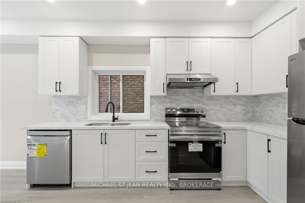 Photo 2 of Unit 2, 489 Cannon Street E, Hamilton, Gibson — HOMEH