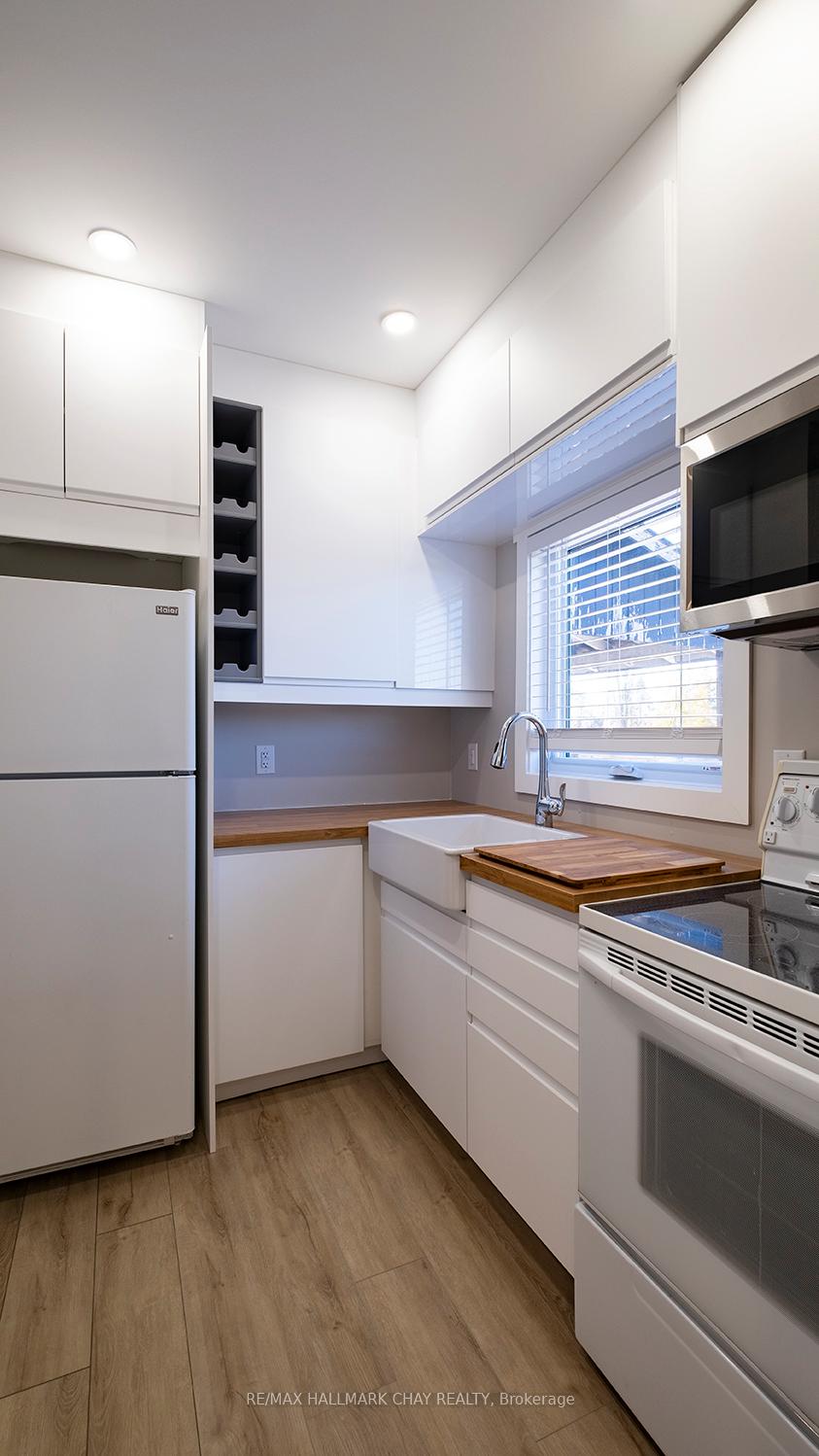 Photo 2 of Unit APT#2, 14 Queen Street, Innisfil, Cookstown — HOMEH