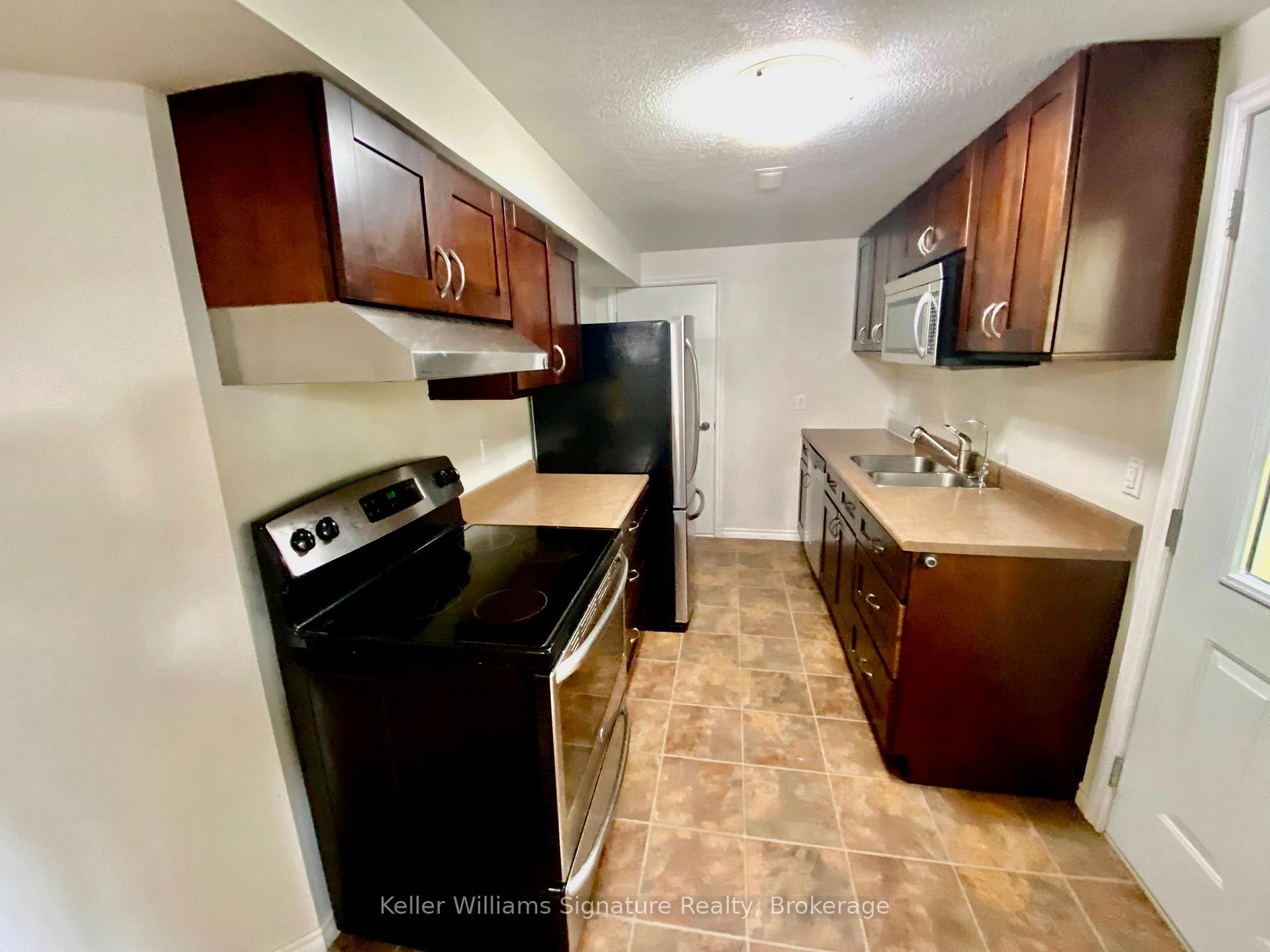 Photo 4 of Unit Bsmt, 68 Isabella Street, Kitchener, Larentian West — HOMEH