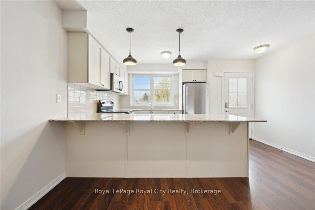 Photo 10 of Unit 86, 701 Homer Watson Boulevard, Kitchener, Trillium Industrial Park — HOMEH