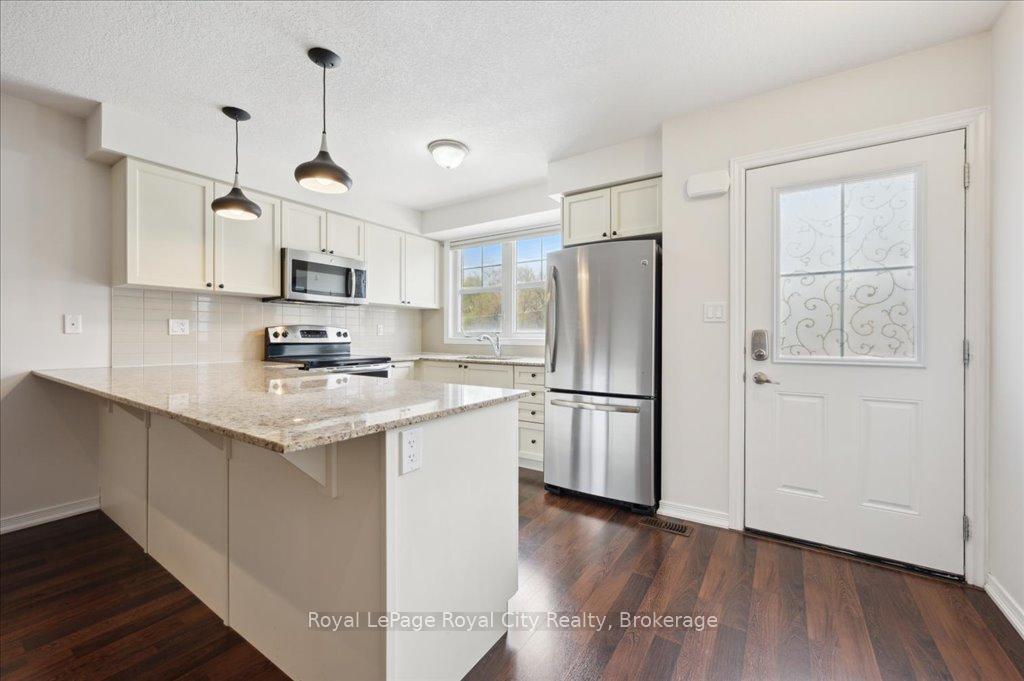 Photo 11 of Unit 86, 701 Homer Watson Boulevard, Kitchener, Trillium Industrial Park — HOMEH