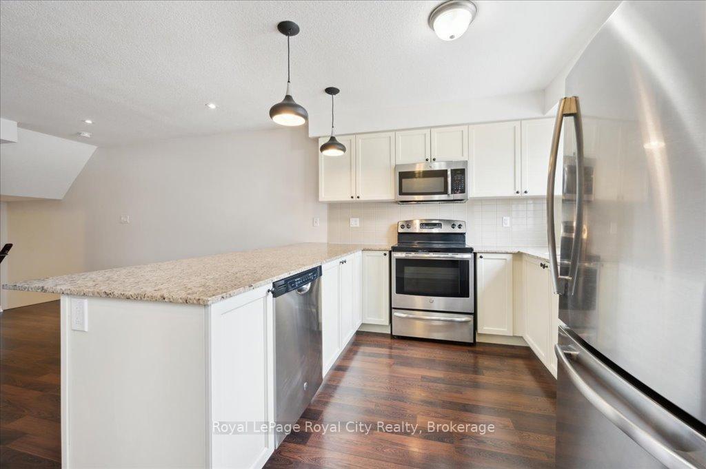 Photo 12 of Unit 86, 701 Homer Watson Boulevard, Kitchener, Trillium Industrial Park — HOMEH