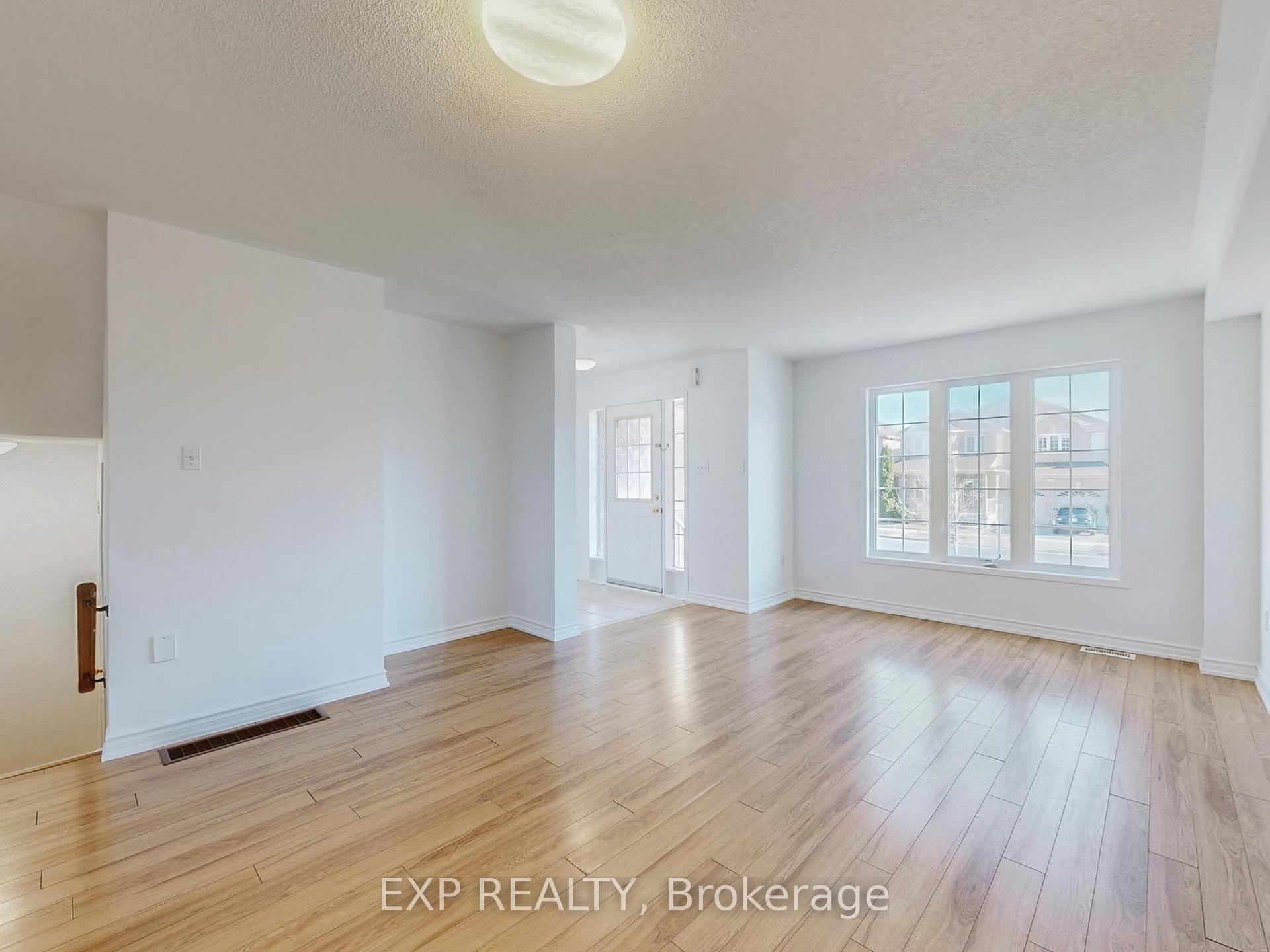 Photo 2 of 702 Castlemore Avenue, Markham, Wismer — HOMEH