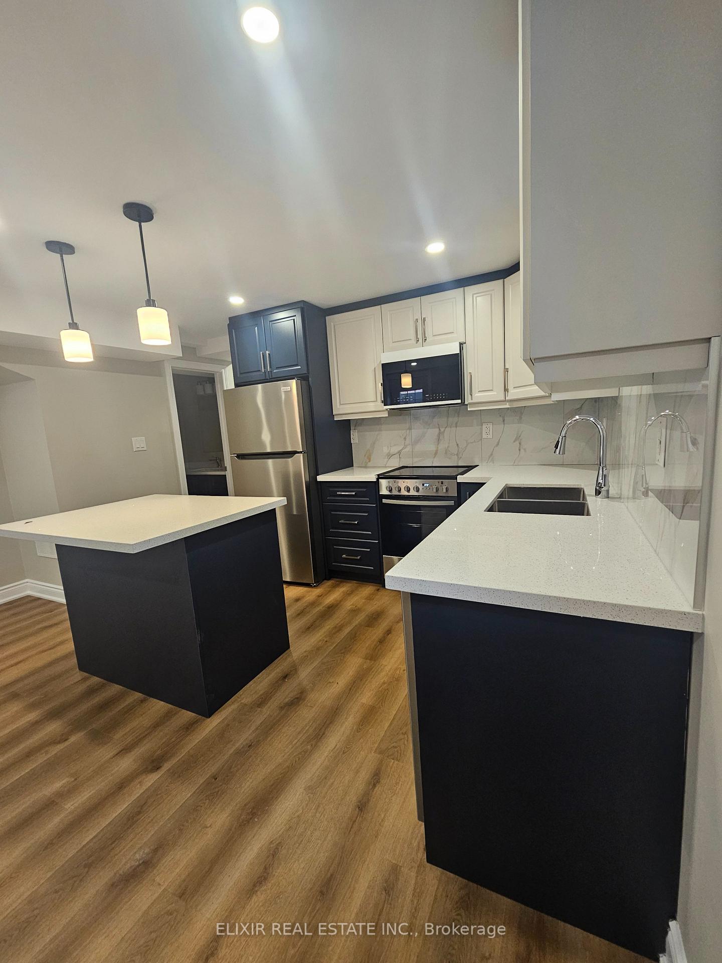 Photo 10 of Unit Basement, 995 Asleton Boulevard, Milton, Willmott — HOMEH