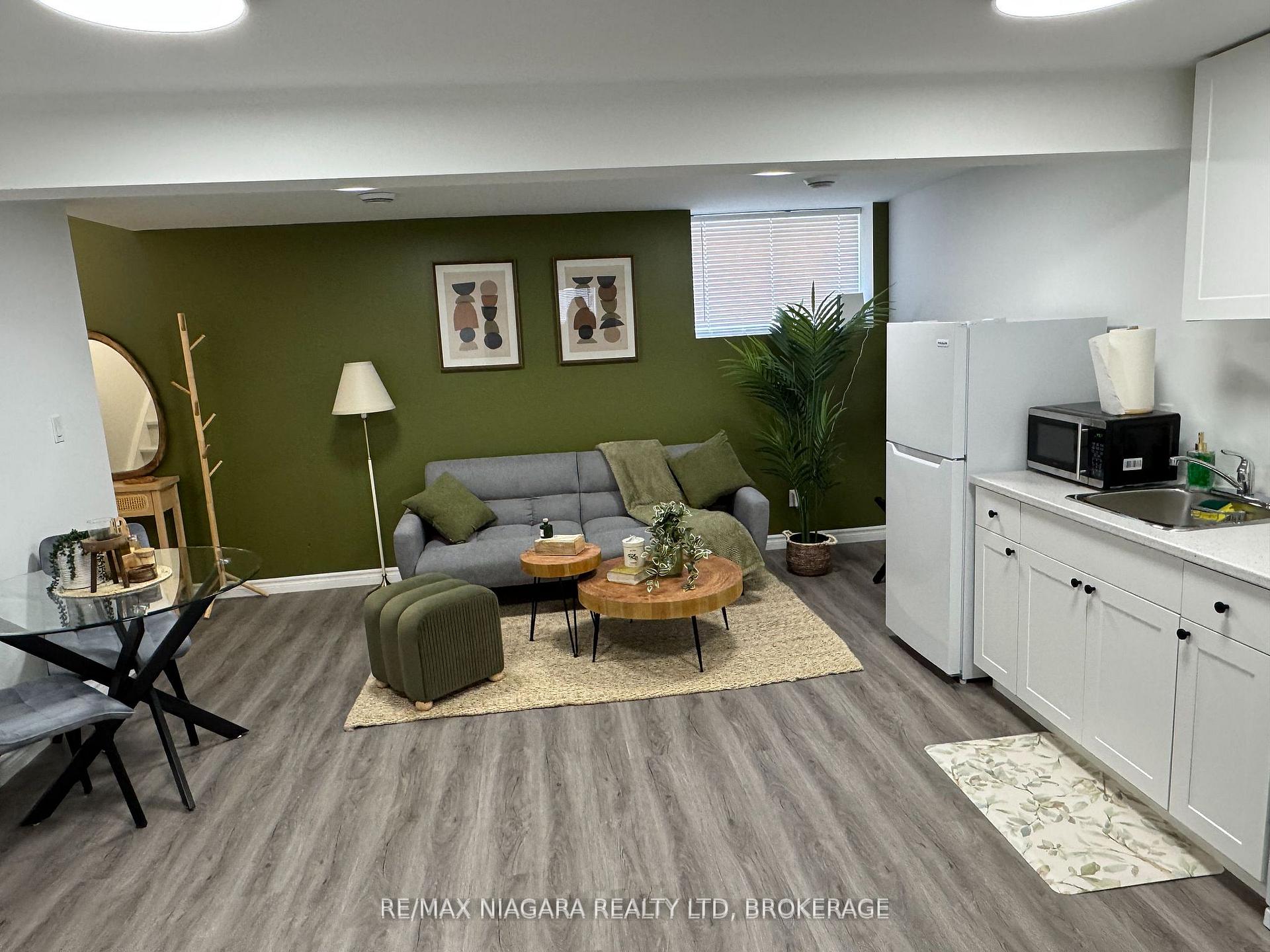 Photo 4 of Unit 4 Lower, 8196 McLeod Road, Niagara Falls, Brown — HOMEH