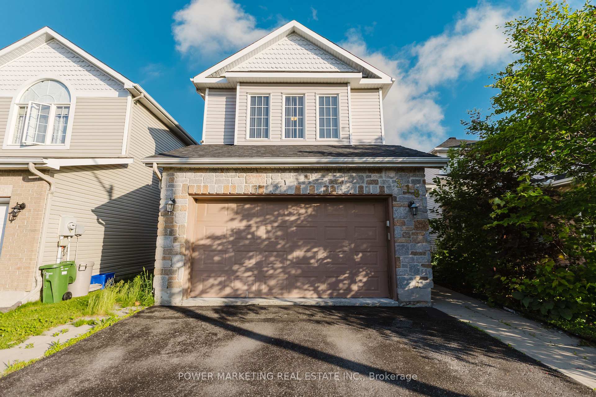 Front of 318 Rustic Hills Crescent