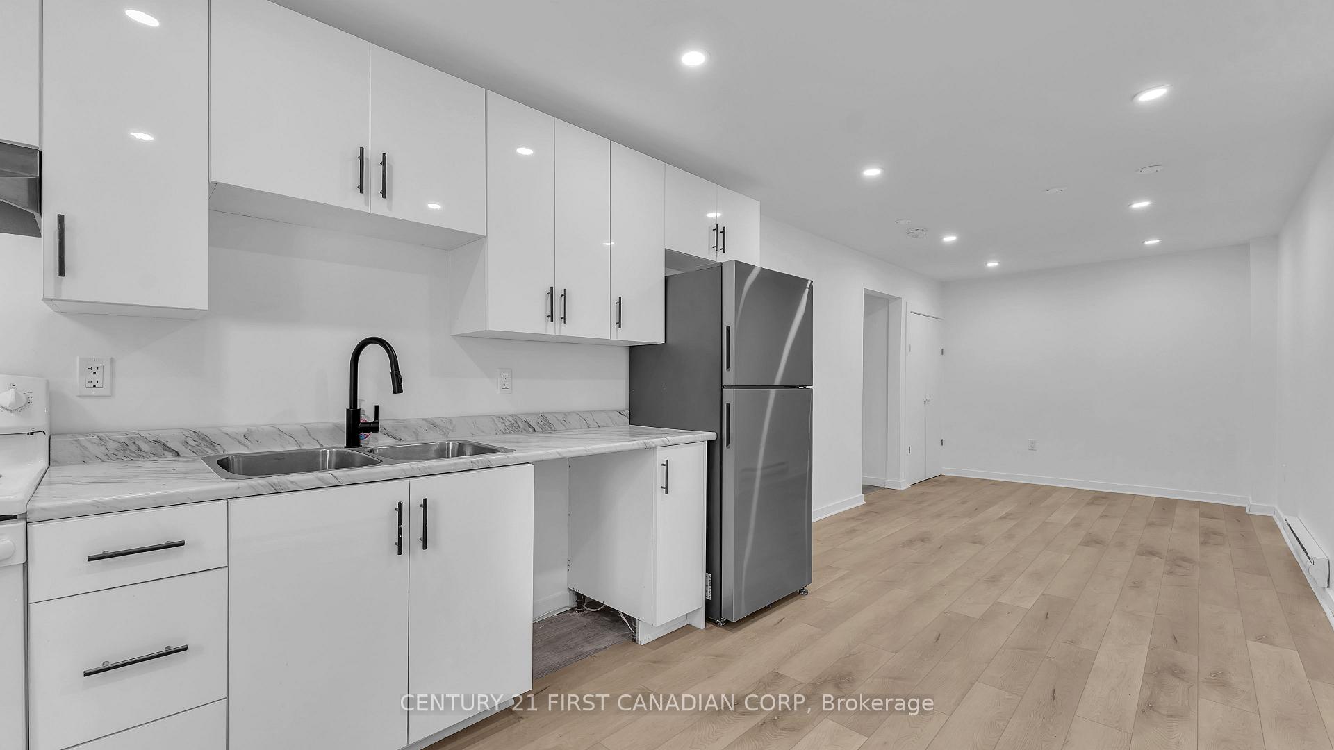 Photo 2 of Unit 2, 413 Main Street S, South Huron, Exeter — HOMEH