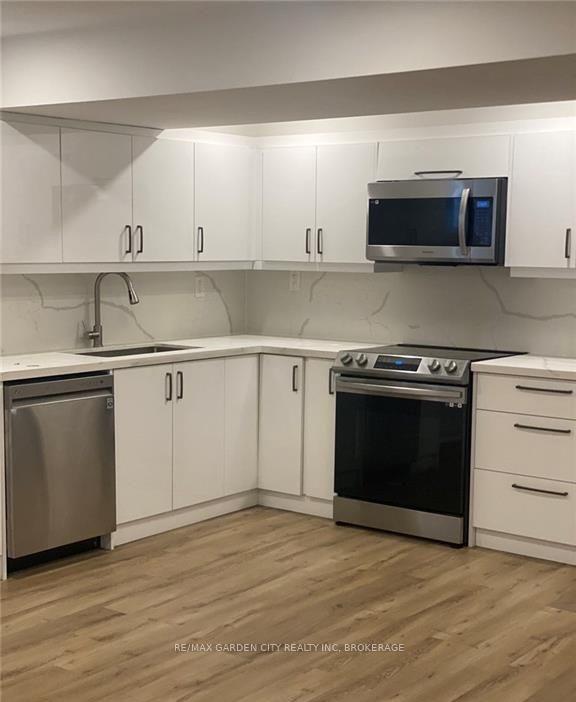 Photo 4 of Unit 4-LOWER LEVEL, 13 Valley Road, St. Catharines, Western Hill — HOMEH
