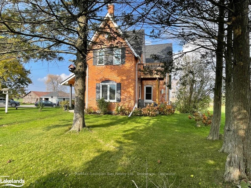 Photo 1 of 1954 Flos Rd 8 W, Springwater, Rural Springwater — HOMEH