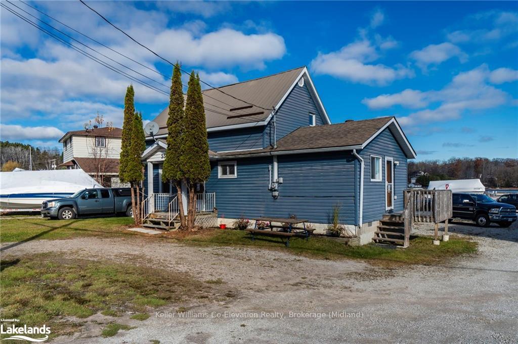 Photo 3 of 555 Champlain Road, Tiny, Rural Tiny — HOMEH