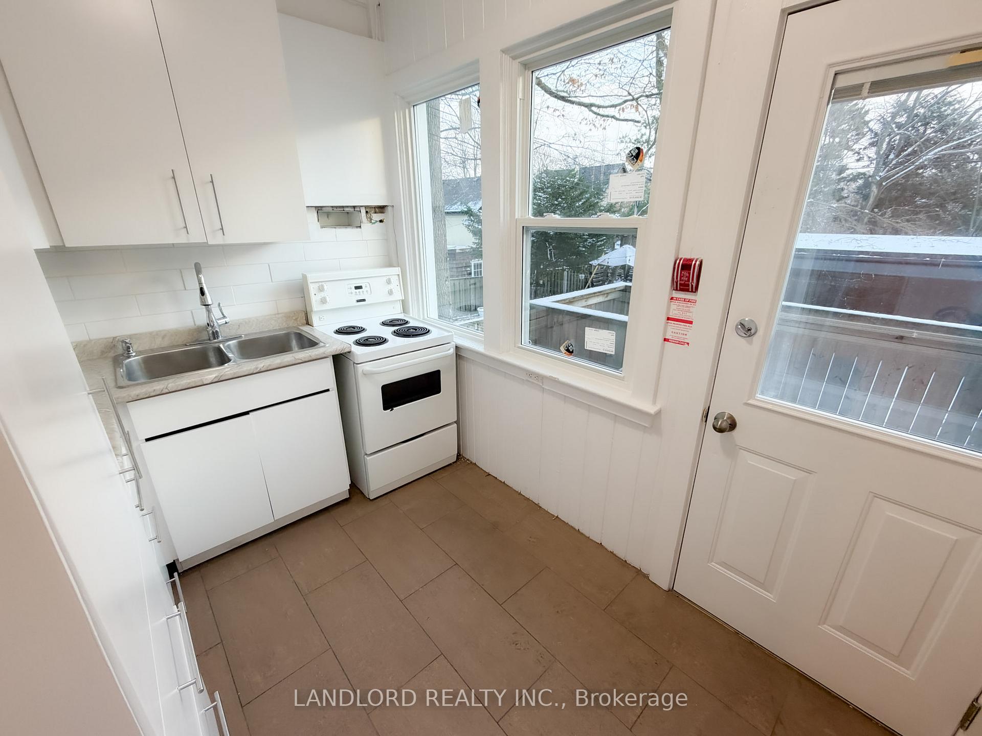 Photo 2 of Unit 1, 2469 Queen Street E, Toronto, The Beaches — HOMEH
