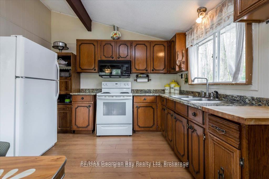 Photo 10 of 25 Tall Pines Drive W, Tiny, Rural Tiny — HOMEH