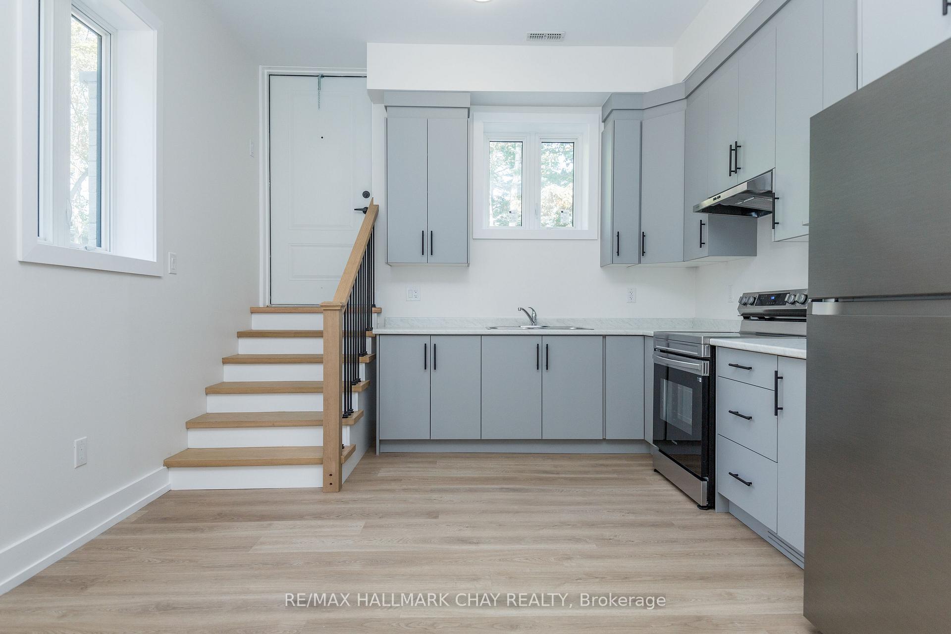 Photo 3 of Unit 1, 58 Ansley Road, Wasaga Beach — HOMEH