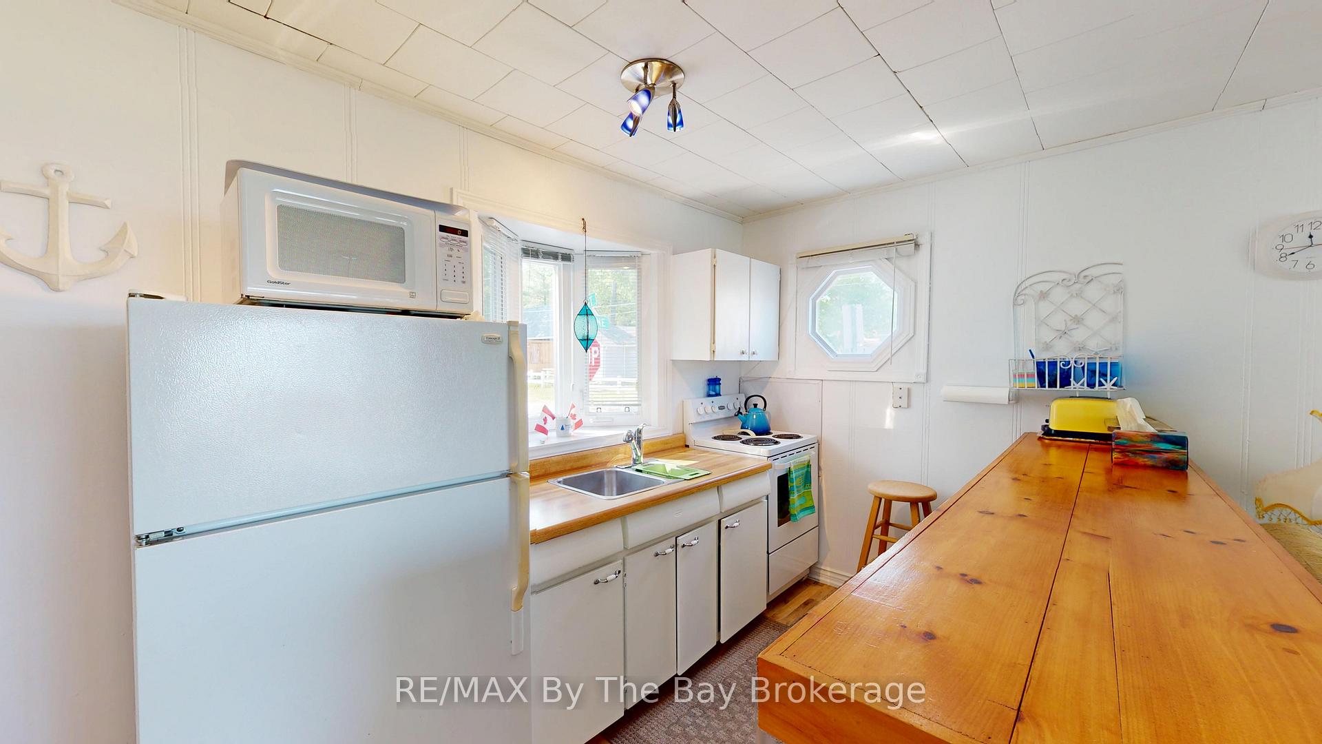 Photo 7 of Unit 3, 5 29th Street N, Wasaga Beach — HOMEH