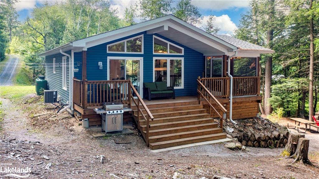 Front of 411 Shawanaga Lake Road