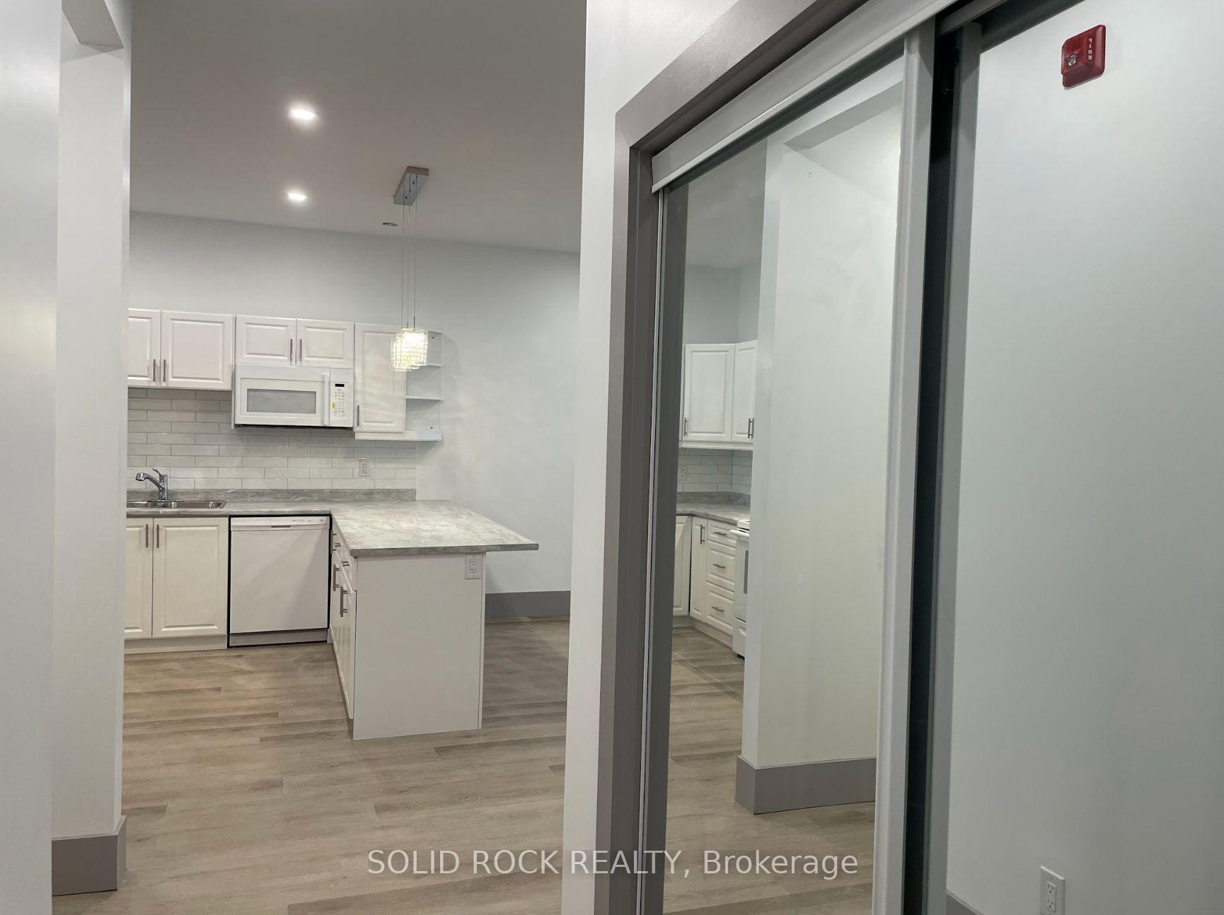 Photo 2 of Unit 202, 48 King Street E, Brockville — HOMEH