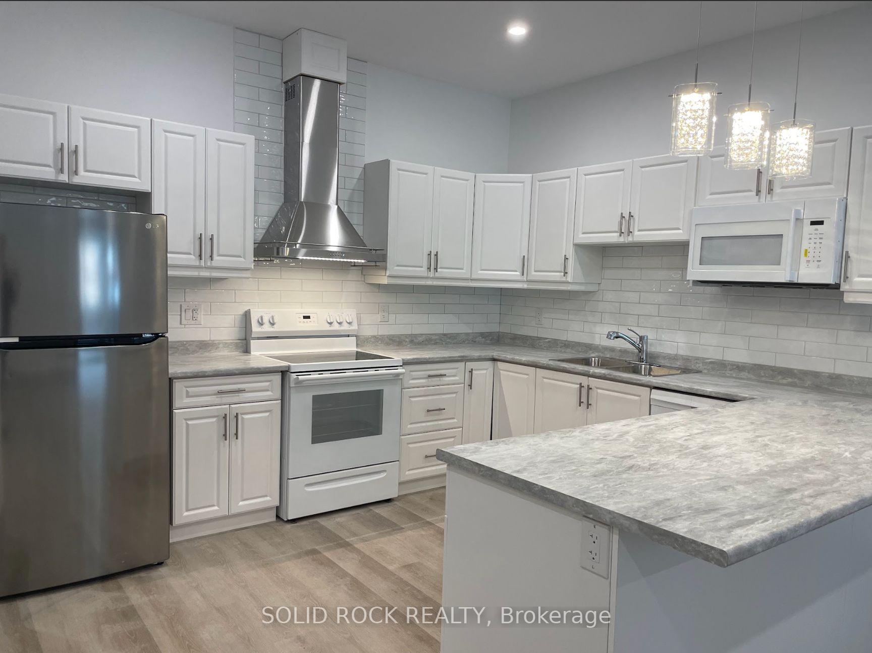 Photo 3 of Unit 202, 48 King Street E, Brockville — HOMEH