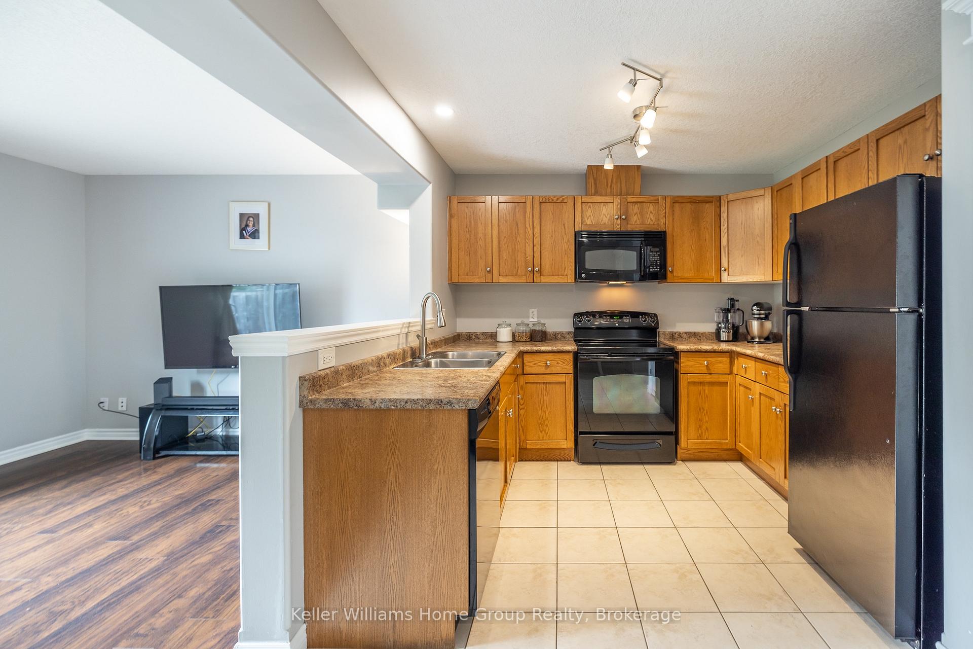 Photo 10 of 49 Washburn Drive, Guelph, Grange Road — HOMEH