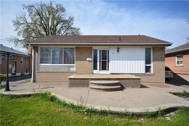 Front of 115 Mcmurchy Avenue S