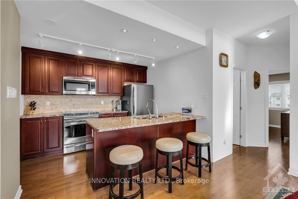 Photo 6 of Unit E, 135 HARTHILL Way E, Ottawa, Barrhaven - Heritage Park — HOMEH