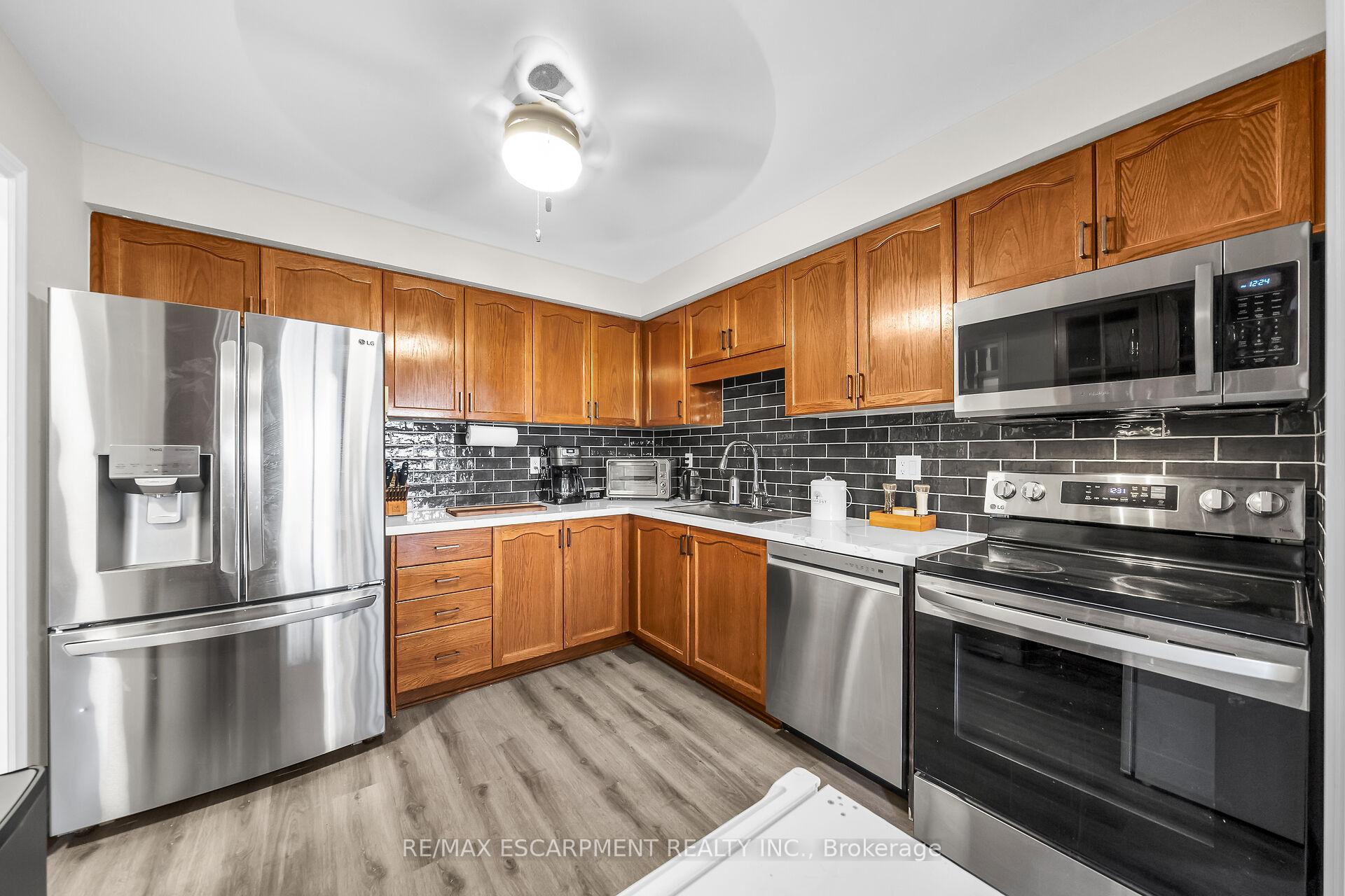 Photo 8 of 5115 Silvercreek Drive, Burlington, Uptown — HOMEH