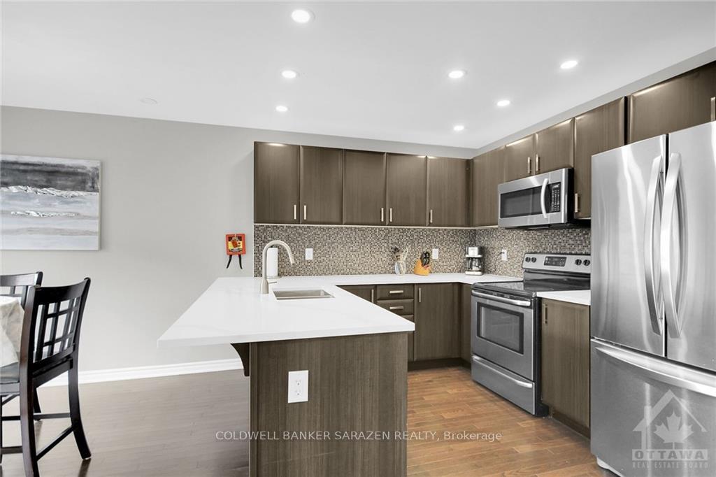 Photo 7 of 411 Meadowhawk Crescent, Ottawa, Barrhaven - Half Moon Bay — HOMEH