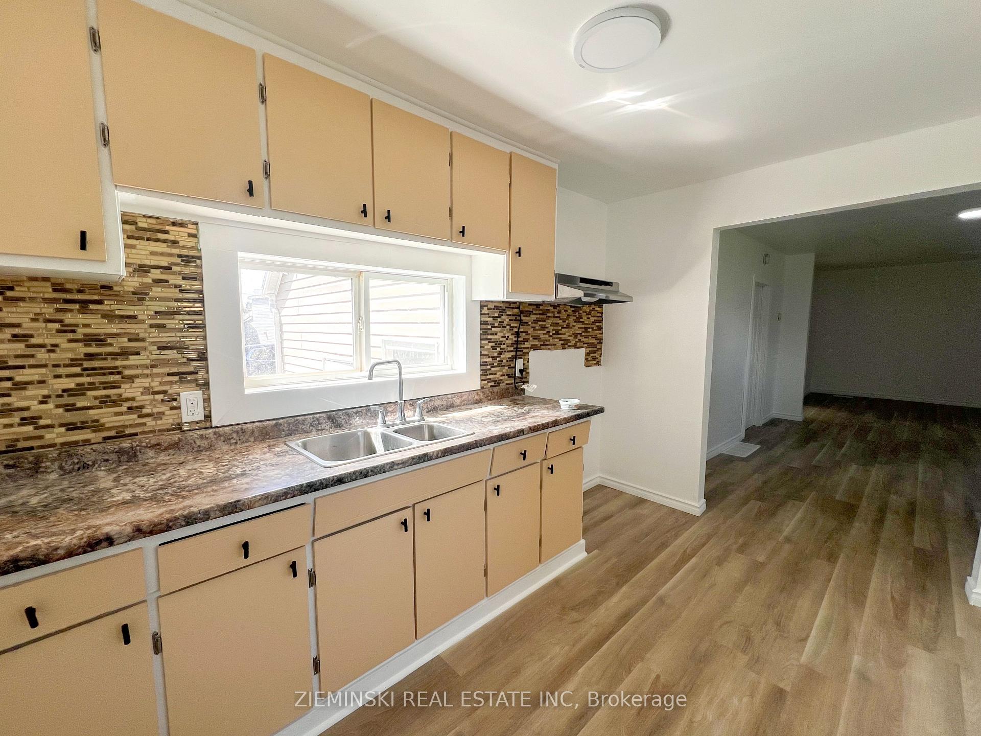 Photo 3 of Unit A, 310 Ninth Avenue, Cochrane — HOMEH