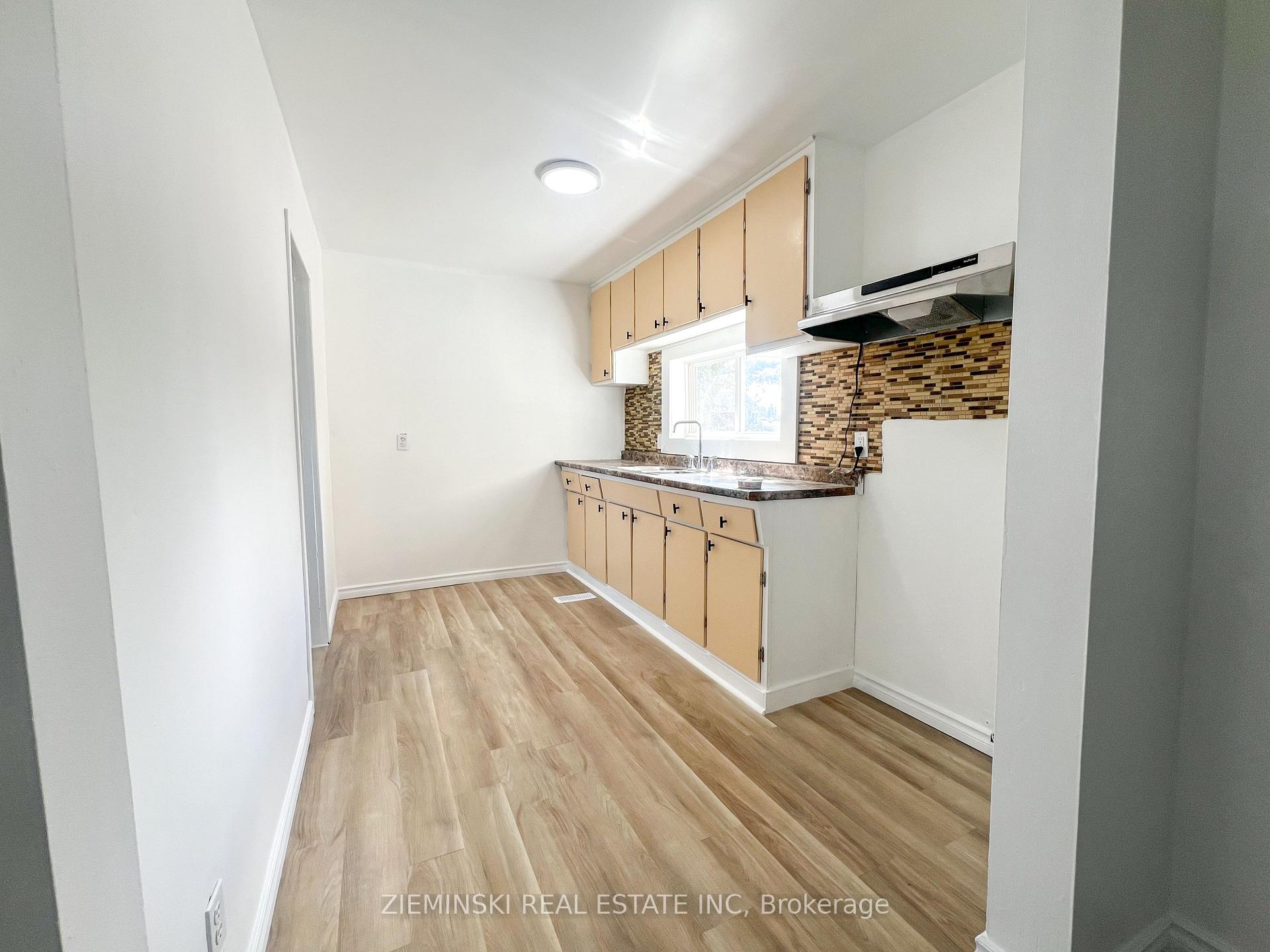 Photo 4 of Unit A, 310 Ninth Avenue, Cochrane — HOMEH