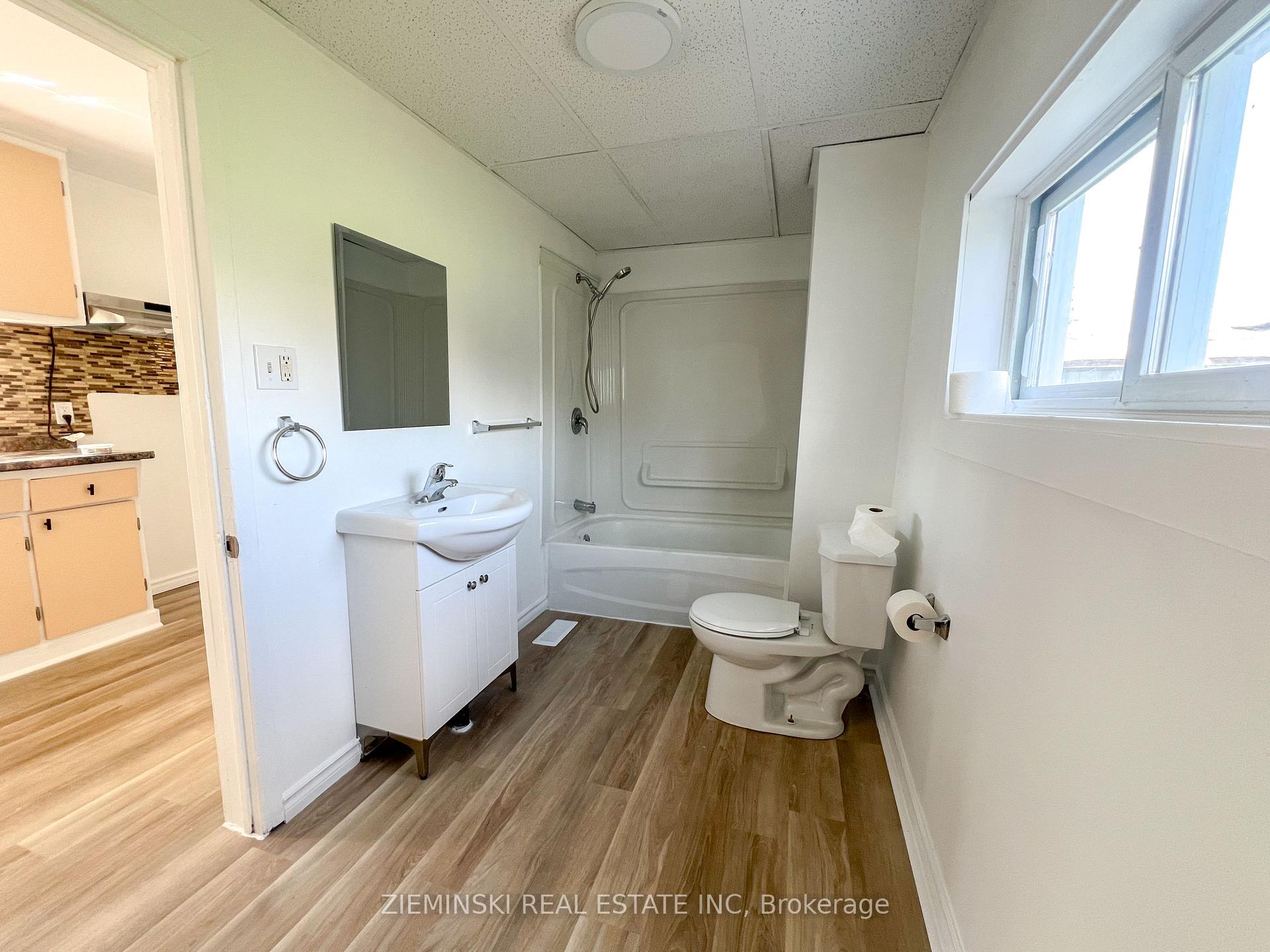 Photo 2 of Unit A, 310 Ninth Avenue, Cochrane — HOMEH