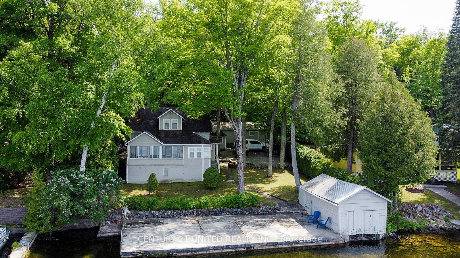 Photo 1 of 406 Carveths Marina Road, Douro-Dummer — HOMEH