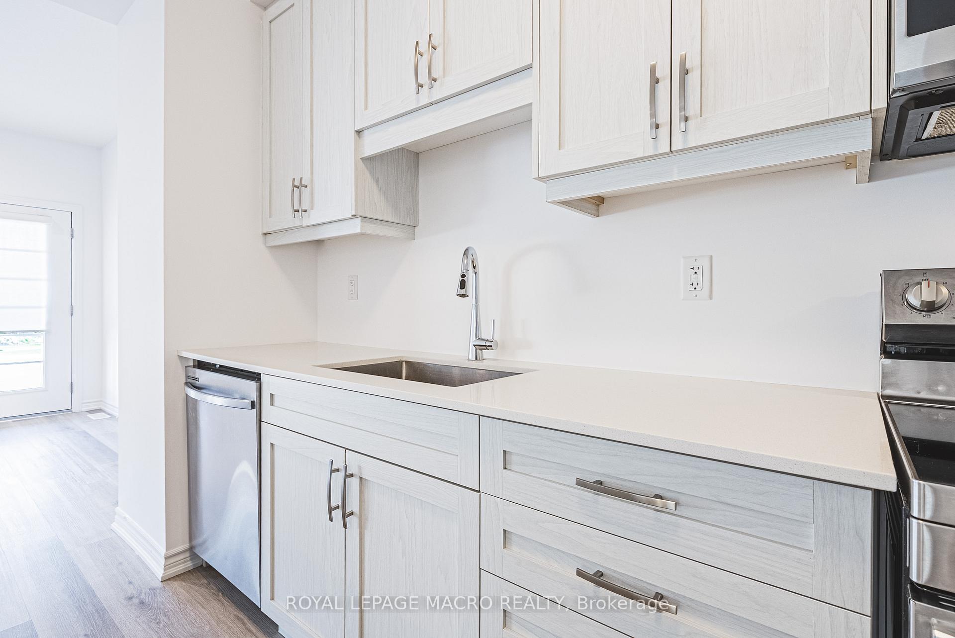 Photo 11 of Unit 5, 461 Blackburn Drive, Brantford — HOMEH