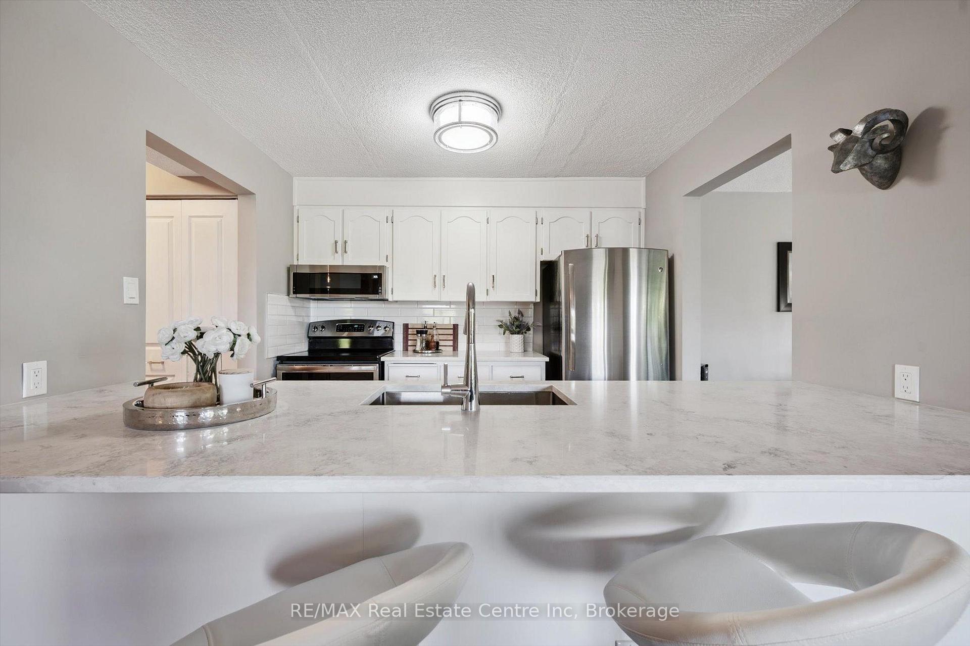 Photo 1 of Unit 306, 8 Christopher Court, Guelph, Kortright West — HOMEH