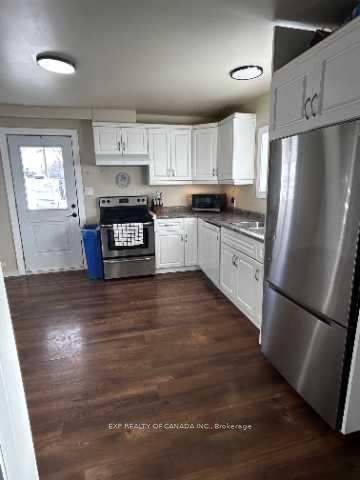 Photo 2 of 206 Eleventh Avenue, Cochrane — HOMEH