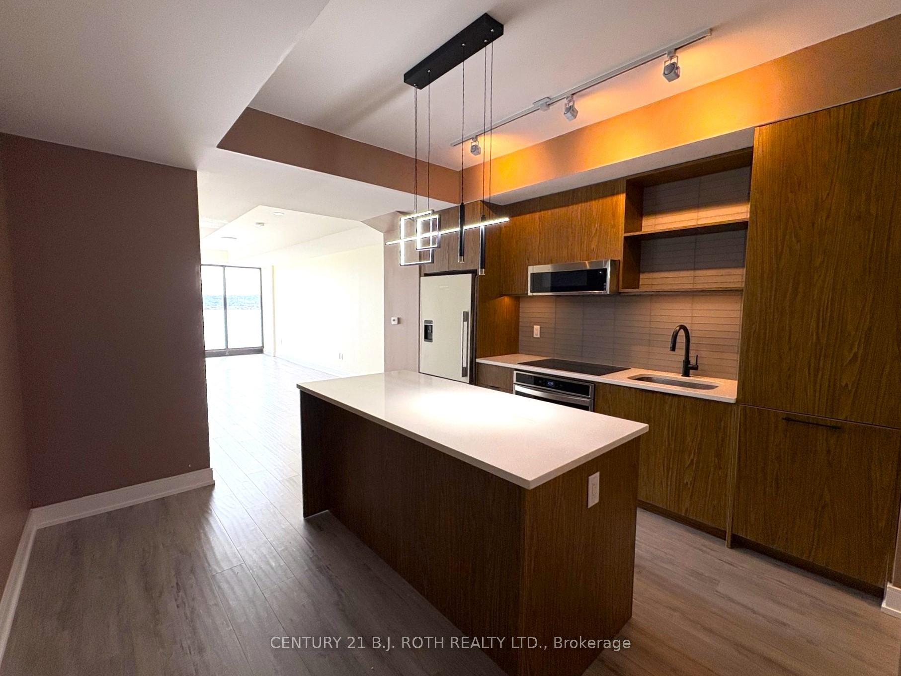 Photo 4 of Unit 609, 185 Dunlop Street, Barrie, Lakeshore — HOMEH