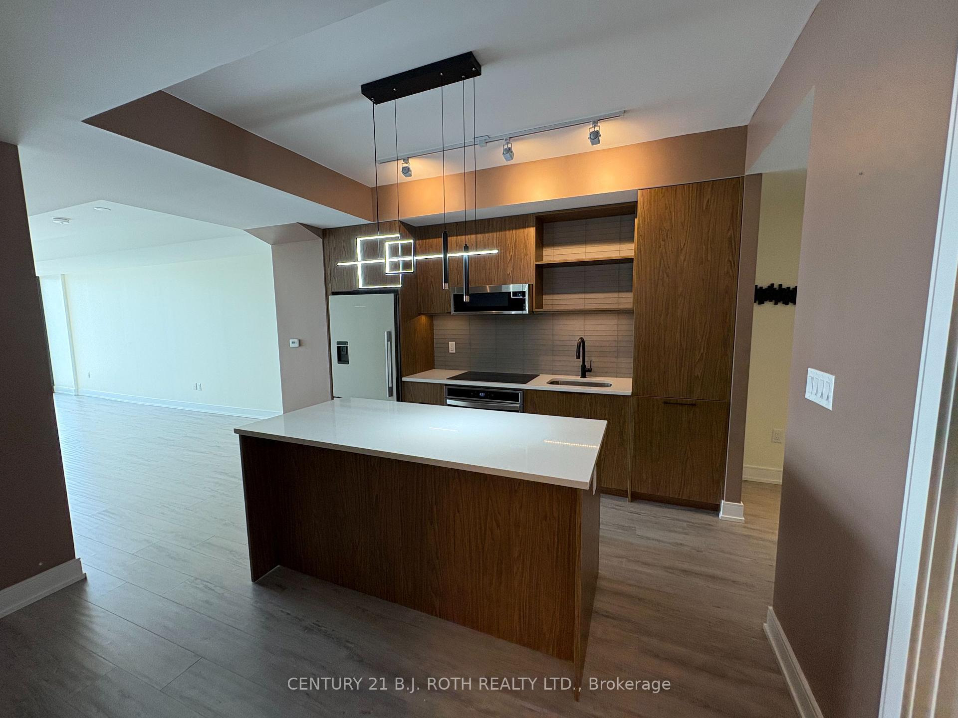 Photo 5 of Unit 609, 185 Dunlop Street, Barrie, Lakeshore — HOMEH