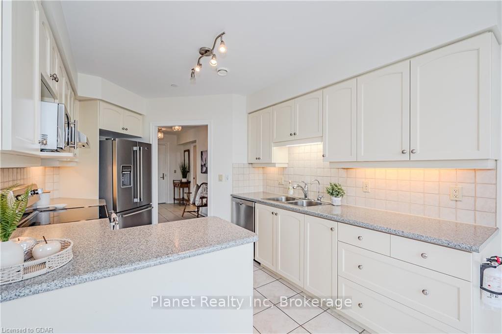 Photo 11 of Unit 407, 65 Bayberry Drive, Guelph, Village By The Arboretum — HOMEH